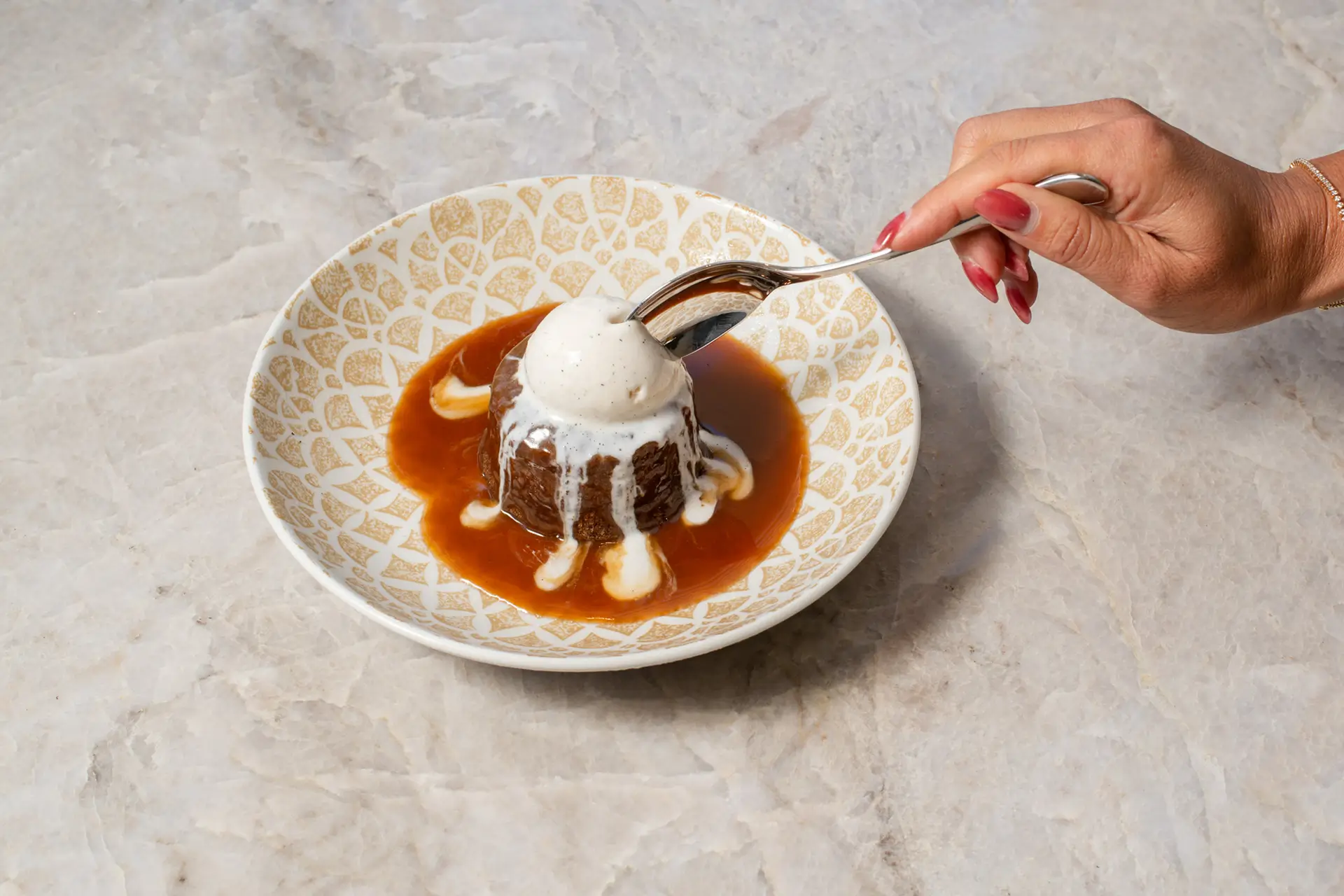 Sticky Toffee Pudding with warm date cake, ice cream and toffee sauce at Gordon Ramsay at The Carnaby.